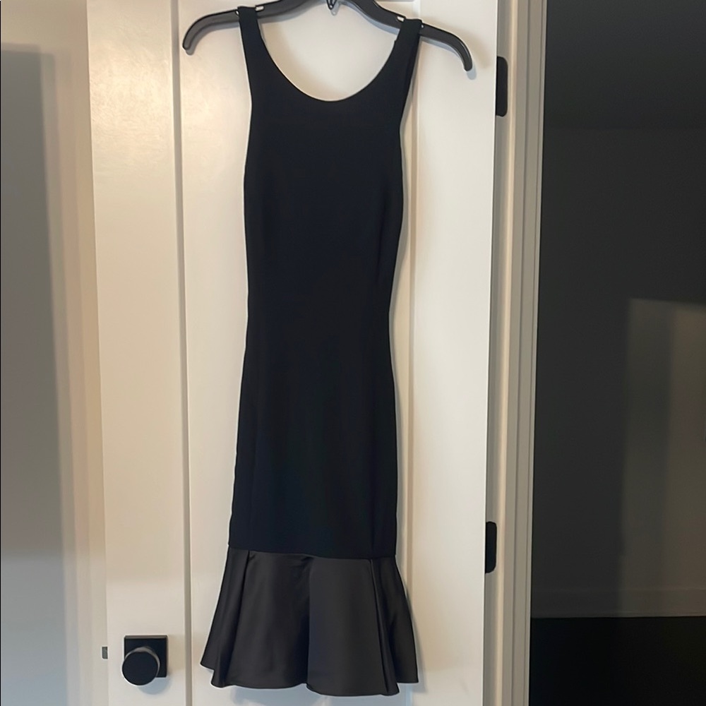 Elegant Black Sleeveless Dress by Vince Camaro
